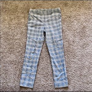 Skinny legged plaid work trousers.